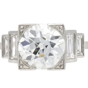 Art Deco diamond flanked solitaire ring, English, circa 1930.